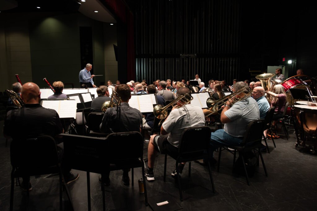 Ensemble members playing with Dr. Mikkelson cunducting in the background